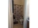 Bathroom with a shower and tub combo featuring a floral shower curtain at 6380 Extreme Shear Ave # 102, Henderson, NV 89011