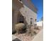 Side view of a home showing windows, stucco exterior, and partial landscaping at 6380 Extreme Shear Ave # 102, Henderson, NV 89011