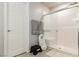 Bathroom featuring tiled shower with glass door and a white door at 7322 Glimmer Point St, North Las Vegas, NV 89084