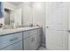 Bathroom featuring a vanity with gray cabinets and a granite countertop at 7322 Glimmer Point St, North Las Vegas, NV 89084