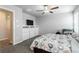 Spacious bedroom featuring a ceiling fan and TV on drawers at 7322 Glimmer Point St, North Las Vegas, NV 89084