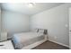 Cozy bedroom featuring neutral walls and carpet with a comfortable queen-sized bed at 7322 Glimmer Point St, North Las Vegas, NV 89084