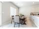 Dining room area featuring a large dark wood table and gray chairs at 7322 Glimmer Point St, North Las Vegas, NV 89084