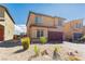 Beautiful two-story home featuring low maintenance desert landscaping and a spacious two-car garage at 7322 Glimmer Point St, North Las Vegas, NV 89084