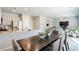 Open concept kitchen and dining room area with neutral colors at 7322 Glimmer Point St, North Las Vegas, NV 89084