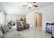 Open-concept living room blending seamlessly with the dining area and modern kitchen for easy living at 7322 Glimmer Point St, North Las Vegas, NV 89084