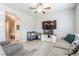 Cozy living room offers tile floors and a seamless transition to other living spaces in the home at 7322 Glimmer Point St, North Las Vegas, NV 89084