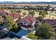 An aerial shot of a house, highlighting the surrounding landscape and neighborhood at 8455 Turtle Creek Cir, Las Vegas, NV 89113