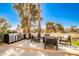 Backyard boasts a built-in grill station, stylish seating arrangements, and meticulous landscaping, creating an outdoor haven at 8455 Turtle Creek Cir, Las Vegas, NV 89113