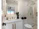 This modern bathroom features sleek fixtures, frameless shower glass and designer finishes at 8455 Turtle Creek Cir, Las Vegas, NV 89113