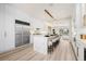 Bright and modern kitchen featuring a large marble island with seating and state-of-the-art appliances at 8455 Turtle Creek Cir, Las Vegas, NV 89113