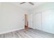 Light and airy bedroom featuring wide plank floors, ceiling fan, and closet with sliding doors at 9824 Gallo Dr, Las Vegas, NV 89147