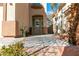 Inviting entrance with a stylish front door, desert landscaping, and a walkway at 9824 Gallo Dr, Las Vegas, NV 89147