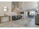 Stylish living room featuring a modern staircase, contemporary decor, and bright natural light at 9824 Gallo Dr, Las Vegas, NV 89147