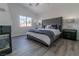 Comfortable main bedroom features a tufted headboard, decorative lamps, and a soft, inviting color palette at 9824 Gallo Dr, Las Vegas, NV 89147