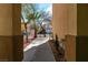 A walkway between buildings showcases the landscaped grounds and exterior architecture at 9824 Gallo Dr, Las Vegas, NV 89147