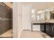 Bathroom featuring a walk-in shower and dark wood cabinets at 1 Grand Masters Dr, Las Vegas, NV 89141