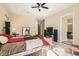 Well-lit bedroom featuring neutral walls, tile flooring, and a ceiling fan at 1 Grand Masters Dr, Las Vegas, NV 89141