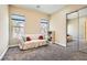 Bedroom with a large window, neutral walls, and a mirrored closet at 1 Grand Masters Dr, Las Vegas, NV 89141