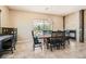 Dining area with tile accent wall, fireplace, and backyard access at 1 Grand Masters Dr, Las Vegas, NV 89141