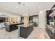 Open kitchen featuring dual islands with granite counters, stainless appliances, and dark wood cabinets at 1 Grand Masters Dr, Las Vegas, NV 89141