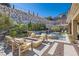 Beautiful backyard pool and patio area perfect for entertaining and relaxation with a serene rock wall at 1 Grand Masters Dr, Las Vegas, NV 89141