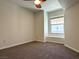 Cozy bedroom with neutral carpet, ceiling fan, and ample natural light at 10001 Peace Way # 2353, Las Vegas, NV 89147