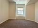 Bedroom with neutral carpet and a window that provides ample natural light at 10001 Peace Way # 2353, Las Vegas, NV 89147