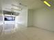 Clean one car garage featuring white walls, lighting, and concrete flooring at 10001 Peace Way # 2353, Las Vegas, NV 89147