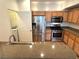 Well-equipped kitchen with stainless steel appliances and wood cabinets at 10001 Peace Way # 2353, Las Vegas, NV 89147