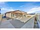 Large backyard with covered patio, gravel area, and sidewalks, ideal for outdoor activities at 101 Deseo Ct, North Las Vegas, NV 89031