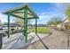 Park pavilion with picnic tables, BBQ grill, and a walking path in a Gathering-friendly neighborhood at 101 Deseo Ct, North Las Vegas, NV 89031