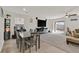 Open concept space featuring a dining area and living space with natural light and modern finishes at 101 Deseo Ct, North Las Vegas, NV 89031