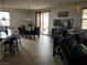 Bright dining area with sliding glass doors, modern chandelier, and easy access to the kitchen at 10355 Sipple St, Las Vegas, NV 89141