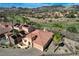 Aerial view of the property featuring desert landscaping, solar panels and view of the mountains at 1150 Calcione Dr, Henderson, NV 89011