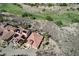 Aerial view of the house features a desert landscape, solar panels and a view of the adjacent golf course at 1150 Calcione Dr, Henderson, NV 89011