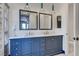 Stylish bathroom featuring a double vanity with framed mirrors and modern pendant lighting at 1150 Calcione Dr, Henderson, NV 89011