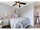 Cozy bedroom featuring a ceiling fan, closet and a large bed with decorative pillows at 1150 Calcione Dr, Henderson, NV 89011