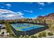 Well-maintained outdoor tennis courts with surrounding desert landscape and mountain views at 1150 Calcione Dr, Henderson, NV 89011