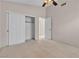 Comfortable carpeted bedroom featuring a closet with sliding doors, neutral colors, and ample space at 1709 Guthrie Dr, Las Vegas, NV 89117