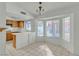 Eat-in kitchen featuring a breakfast bar, tile floors, and plenty of natural light at 1709 Guthrie Dr, Las Vegas, NV 89117