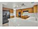 Well-equipped kitchen with ample counter space, modern appliances, and natural wood cabinetry at 1709 Guthrie Dr, Las Vegas, NV 89117