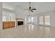 Bright living room with tile flooring, fireplace, and backyard access at 1709 Guthrie Dr, Las Vegas, NV 89117