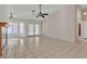 Spacious living room featuring tile flooring, fireplace, and backyard access at 1709 Guthrie Dr, Las Vegas, NV 89117