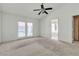 Main bedroom featuring carpet flooring and direct backyard access at 1709 Guthrie Dr, Las Vegas, NV 89117