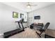 Relaxing bedroom with neutral walls, carpet, ceiling fan, and a small work out station at 181 Sierra Alta Pl, Henderson, NV 89015