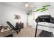 Cozy bedroom with neutral walls, carpet, ceiling fan, and a small work out station at 181 Sierra Alta Pl, Henderson, NV 89015