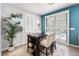 Bright dining area with modern shelving and a large sliding glass door leading to the pool at 181 Sierra Alta Pl, Henderson, NV 89015