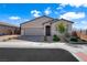 Charming single-story home with low-maintenance landscaping and a two-car garage at 181 Sierra Alta Pl, Henderson, NV 89015