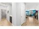 Hallway view with a laundry closet leading to the living room with ample natural light at 181 Sierra Alta Pl, Henderson, NV 89015